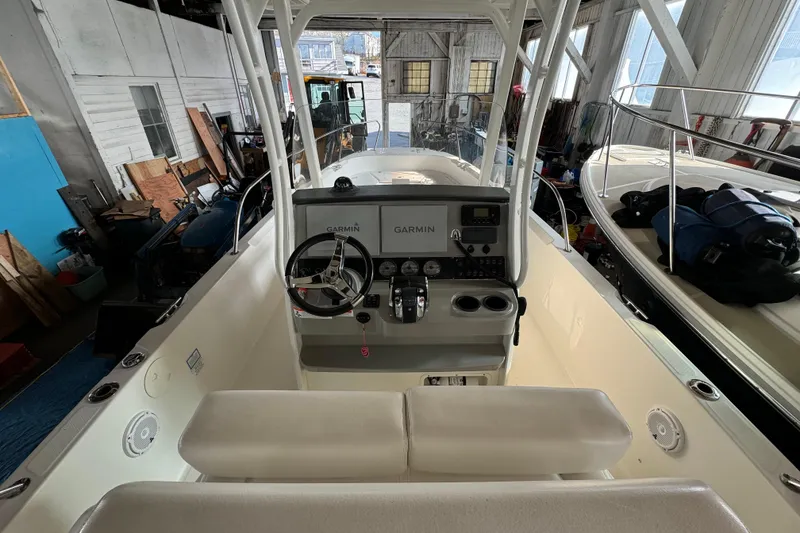 Slide: The Image of 2014 Boston Whaler 270 Dauntless boat interior with Garmin navigation system in a storage facility. - 9