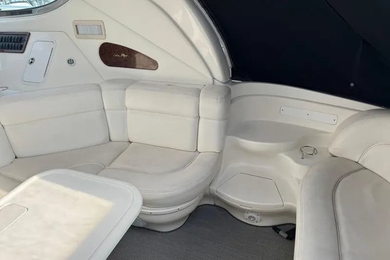Slide: The Image of Luxurious interior seating of 2001 Sea Ray 510 Sundancer yacht with white upholstery. - 11