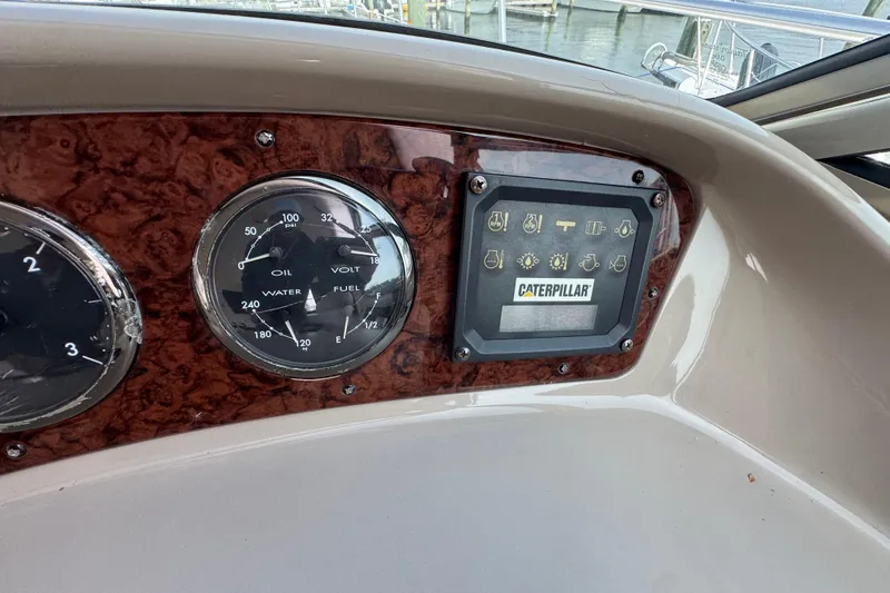 Slide: The Image of Dashboard of 2001 Sea Ray 510 Sundancer with gauges and Caterpillar display. - 12