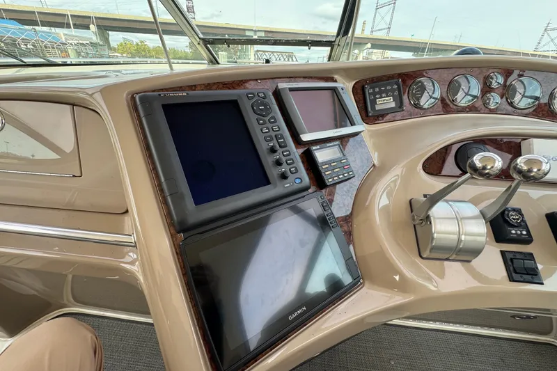 Slide: The Image of Control panel of a 2001 Sea Ray 510 Sundancer yacht with navigation equipment. - 13