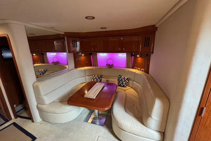 Slide: The Image of Luxurious interior of 2001 Sea Ray 510 Sundancer yacht with plush seating and elegant decor. - 17
