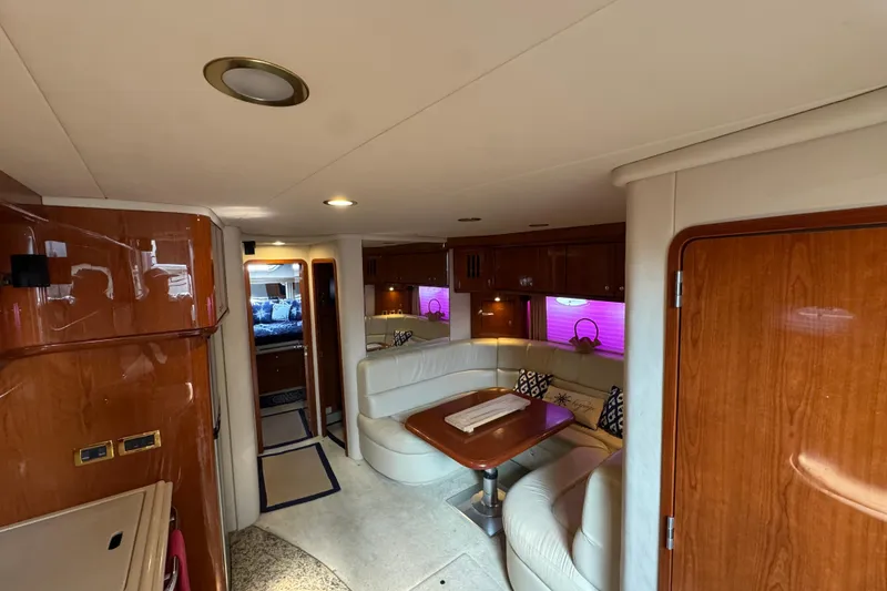 Slide: The Image of Luxurious interior of 2001 Sea Ray 510 Sundancer yacht with elegant seating and wood finishes. - 18