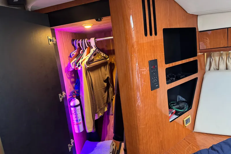 Slide: The Image of Interior of 2001 Sea Ray 510 Sundancer with closet and control panel. - 21