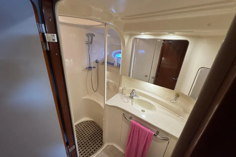Slide: The Image of Bathroom interior of 2001 Sea Ray 510 Sundancer yacht, featuring shower and sink. - 22