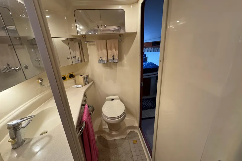 Slide: The Image of Luxurious bathroom in 2001 Sea Ray 510 Sundancer yacht, featuring modern fixtures and elegant design. - 23