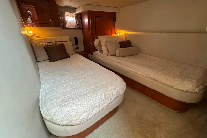 Slide: The Image of Luxurious twin cabin interior of 2001 Sea Ray 510 Sundancer yacht. - 26
