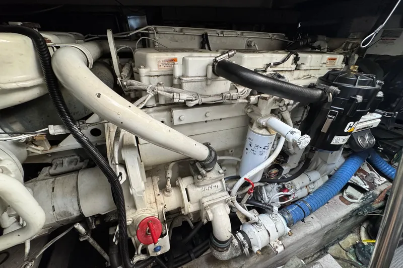 Slide: The Image of Engine compartment of a 2001 Sea Ray 510 Sundancer yacht, showcasing mechanical components. - 30