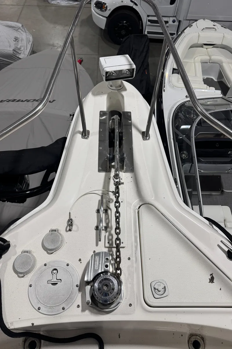 Slide: The Image of 2000 Sea Ray 460 Sundancer boat deck with anchor chain and winch system. - 10