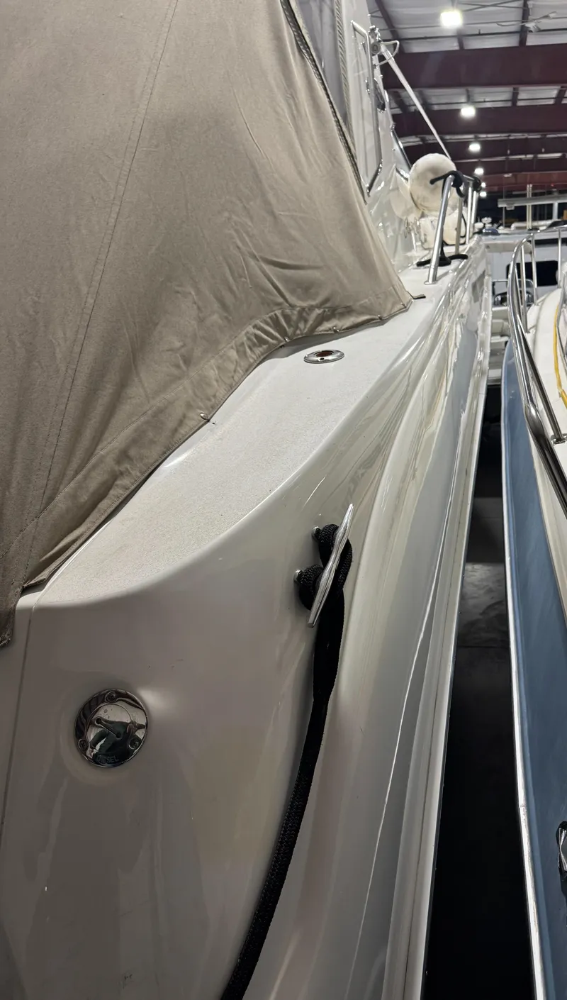 Slide: The Image of 2000 Sea Ray 460 Sundancer yacht, covered and docked indoors. - 12