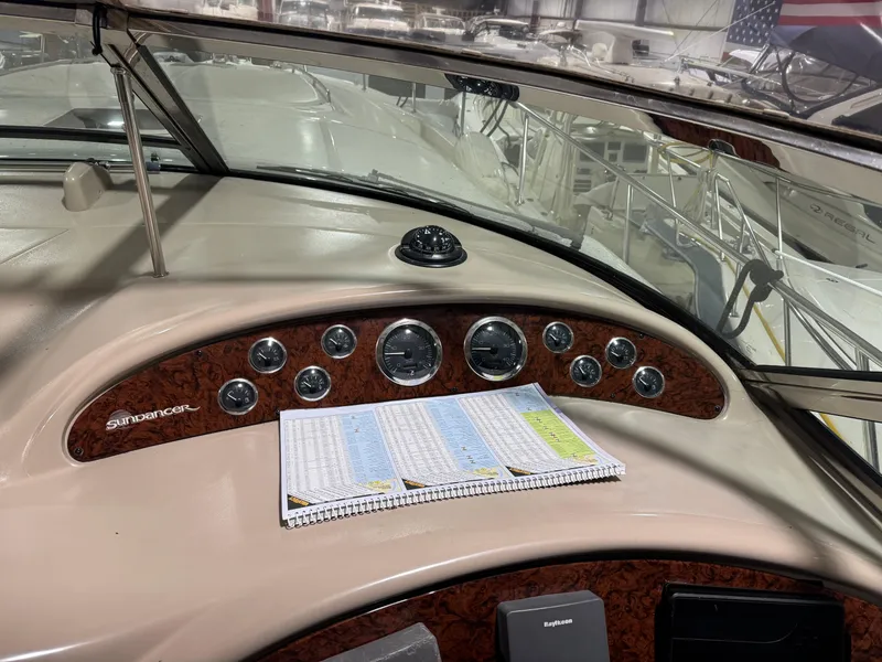 Slide: The Image of Dashboard of a 2000 Sea Ray 460 Sundancer yacht with navigation instruments. - 18