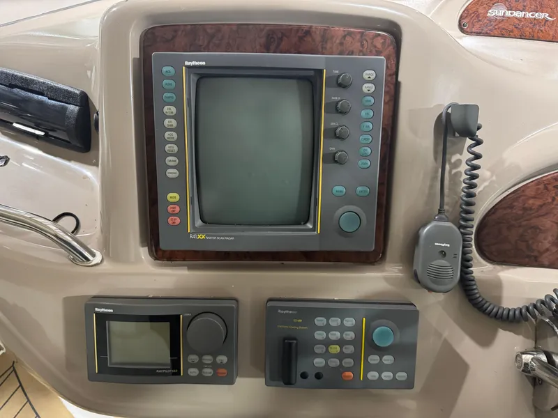 Slide: The Image of Control panel of a 2000 Sea Ray 460 Sundancer boat with navigation equipment. - 19