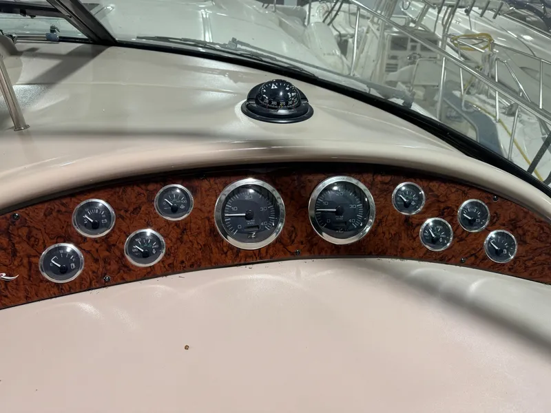 Slide: The Image of Dashboard of a 2000 Sea Ray 460 Sundancer with gauges and compass. - 20