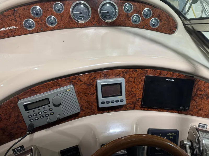 Slide: The Image of Dashboard of a 2000 Sea Ray 460 Sundancer with navigation and control instruments. - 21