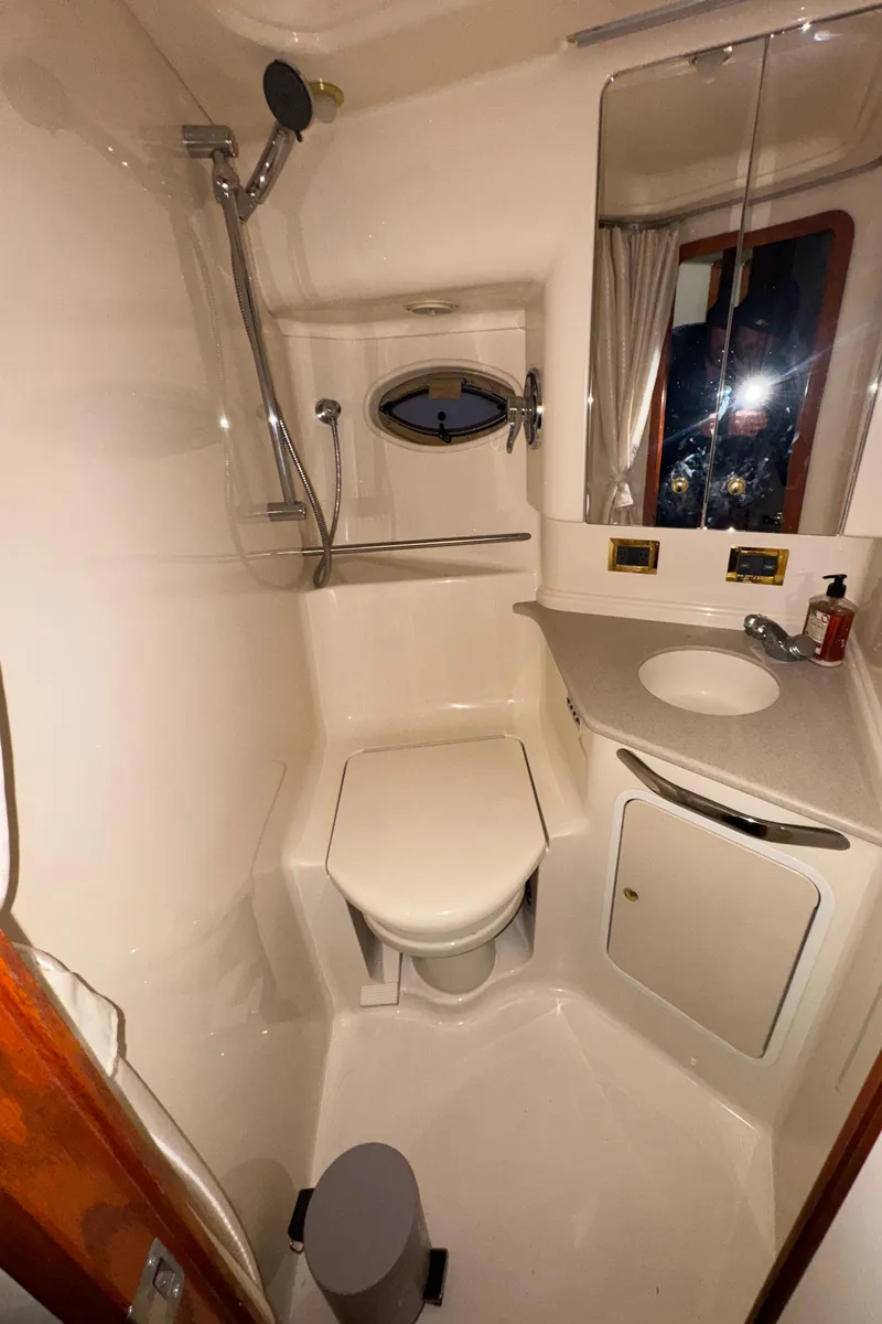 Slide: The Image of Bathroom interior of 2000 Sea Ray 460 Sundancer yacht with shower and sink. - 29