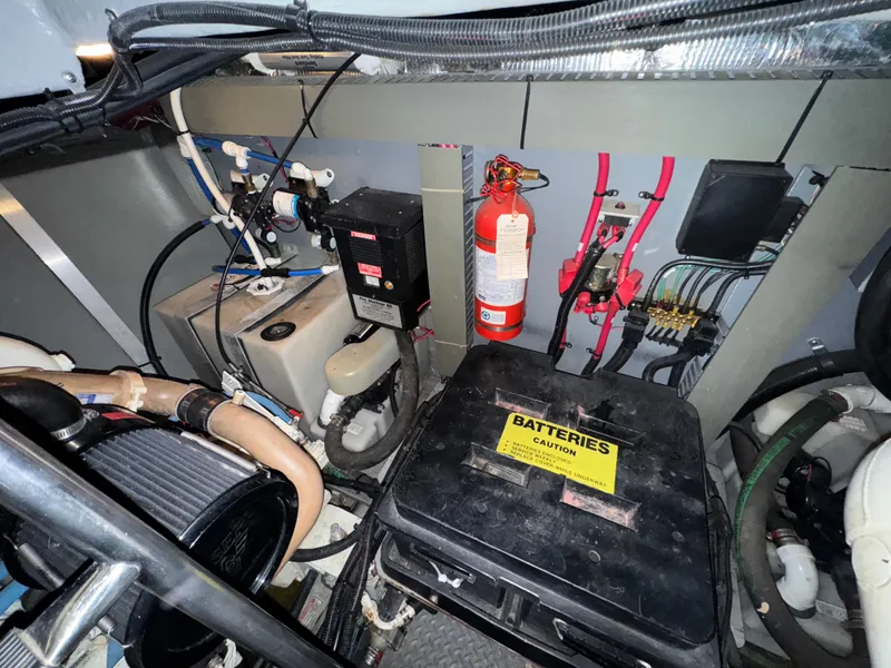 Slide: The Image of Engine room of a 2000 Sea Ray 460 Sundancer with batteries and fire extinguisher. - 34