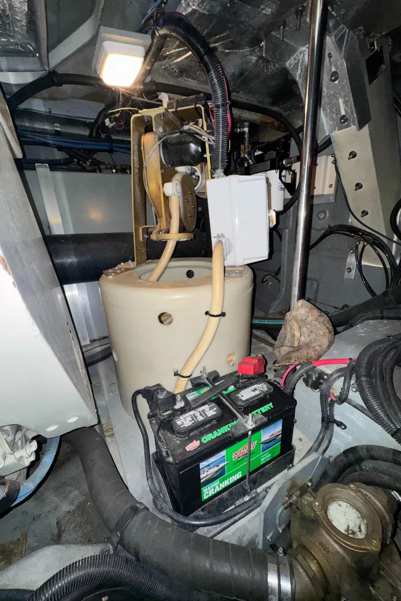 Slide: The Image of Engine room of a 2000 Sea Ray 460 Sundancer with battery and wiring. - 39