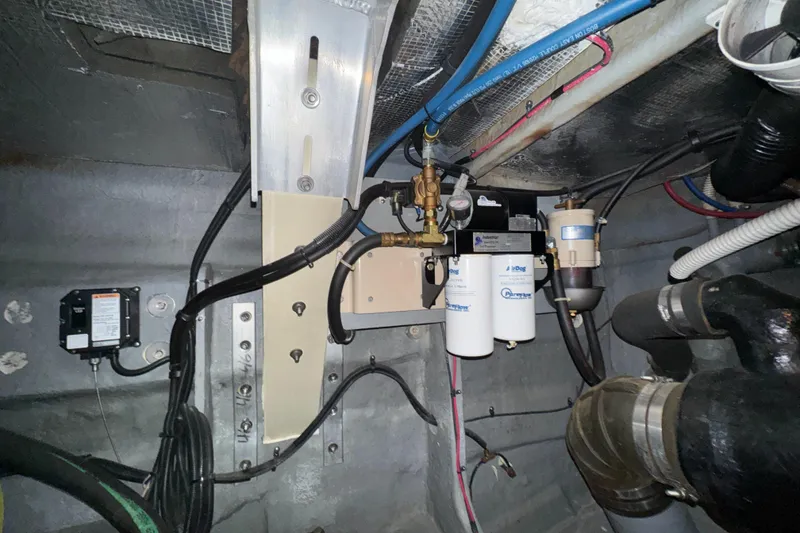 Slide: The Image of Engine room of 2000 Sea Ray 460 Sundancer with visible wiring and components. - 40