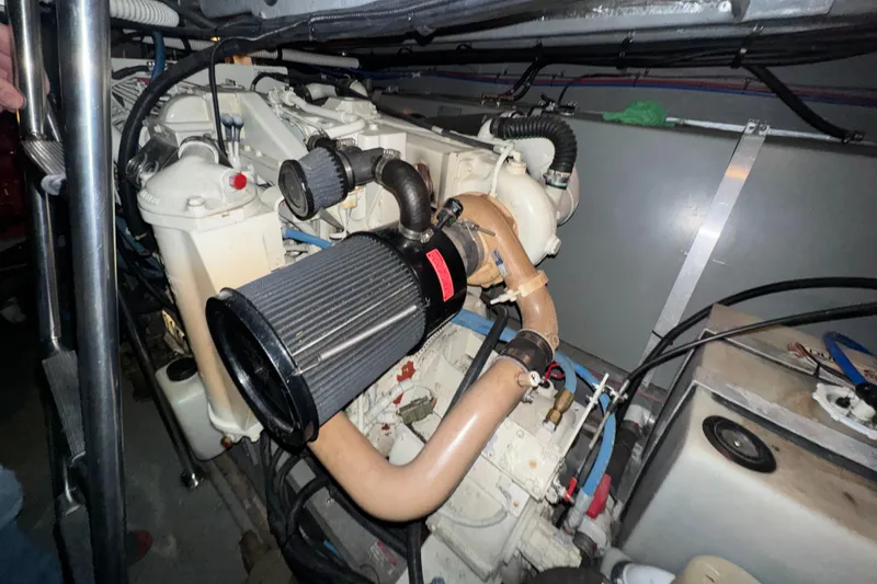 Slide: The Image of Engine compartment of a 2000 Sea Ray 460 Sundancer boat, showcasing detailed components. - 41