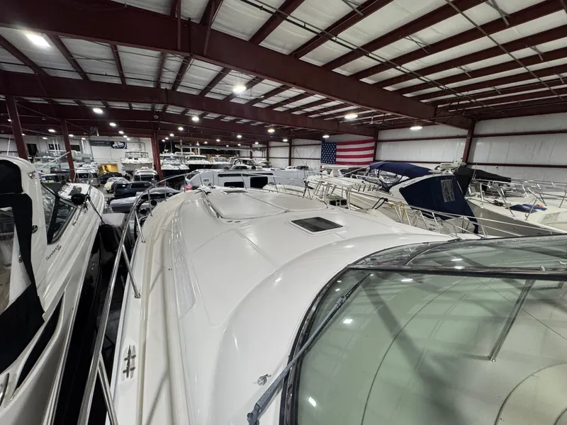 Slide: The Image of Indoor storage of a 2000 Sea Ray 460 Sundancer yacht among other boats. - 7