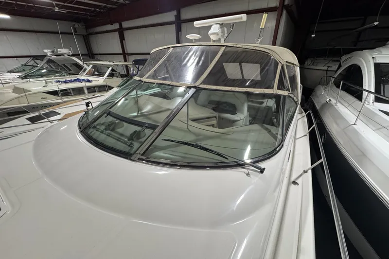 Slide: The Image of Sea Ray 460 Sundancer 2000 yacht in storage, featuring sleek design and spacious cockpit. - 8