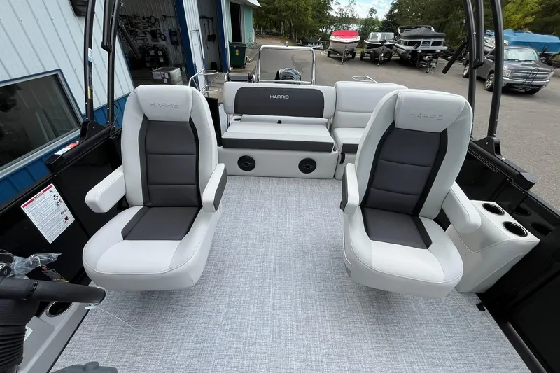 Slide: The Image of 2026 Harris Cruiser 230 boat interior with plush seating and modern design. - 12