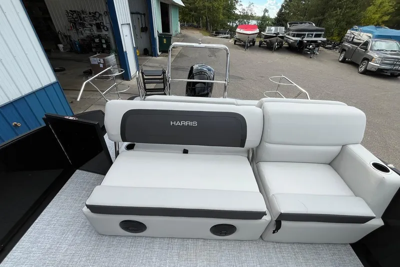 Slide: The Image of 2026 Harris Cruiser 230 boat interior with plush seating and modern design. - 13