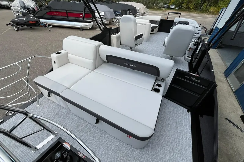 Slide: The Image of 2026 Harris Cruiser 230 pontoon boat with spacious seating and modern design. - 17
