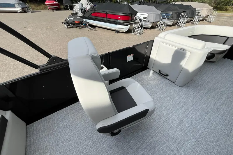 Slide: The Image of 2026 Harris Cruiser 230 boat interior with modern seating and carpeted flooring. - 20