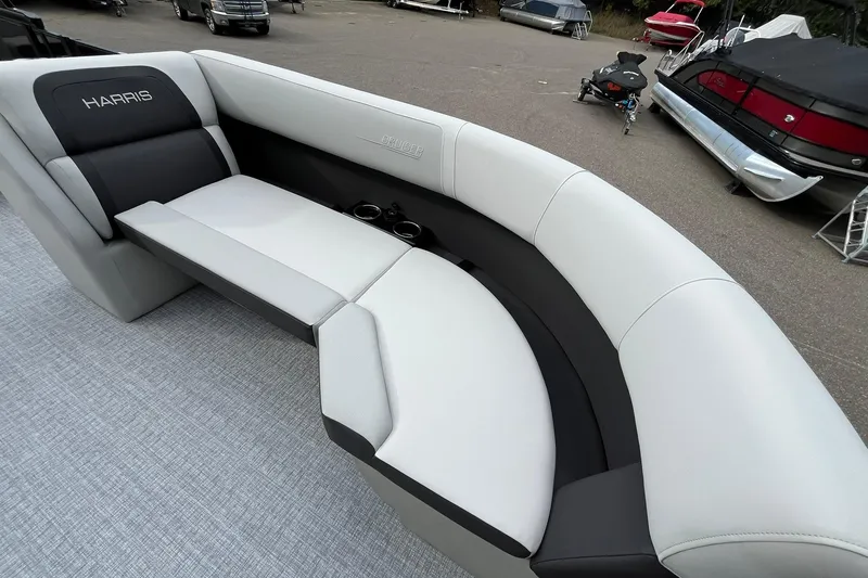 Slide: The Image of 2026 Harris Cruiser 230 boat interior with sleek, modern seating and cup holders. - 34