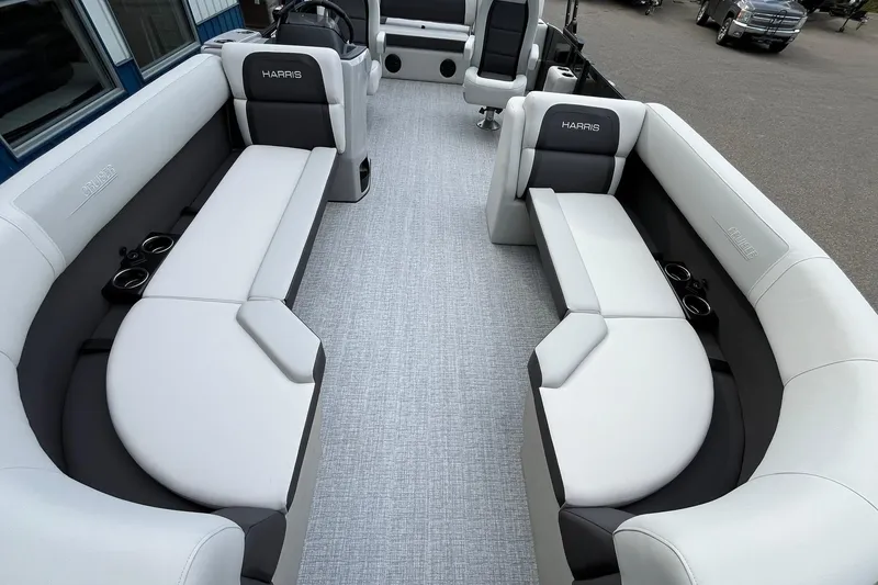 Slide: The Image of Luxurious interior of 2026 Harris Cruiser 230 pontoon boat with plush seating and cup holders. - 9