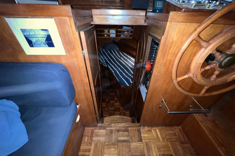 Slide: The Image of 1979 Litton Trawler interior with vintage navigation equipment and nautical decor. - 11
