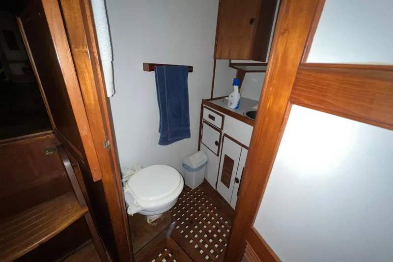 Slide: The Image of Wooden closet with colorful jackets on a 1979 Litton Trawler boat. - 13