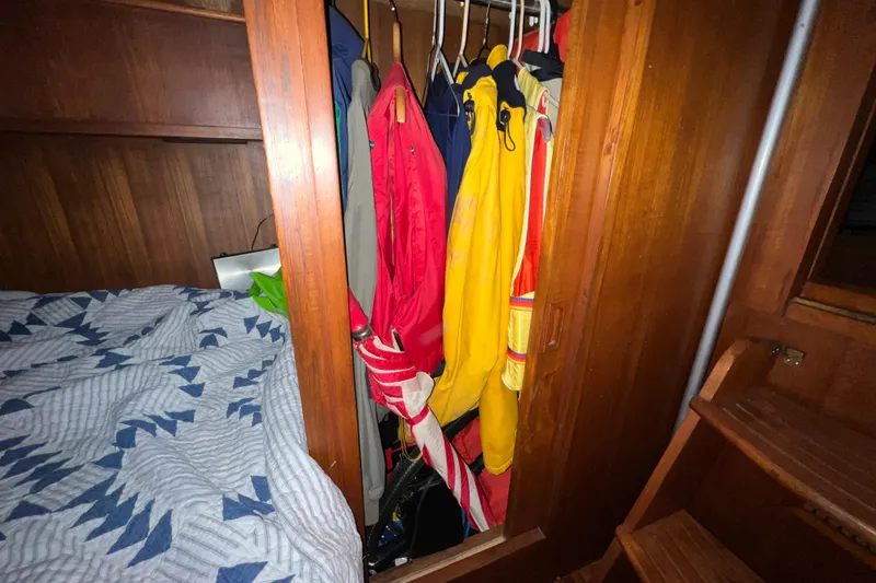 Slide: The Image of 1979 Litton Trawler bathroom with sink, toiletries, and wooden accents. - 14