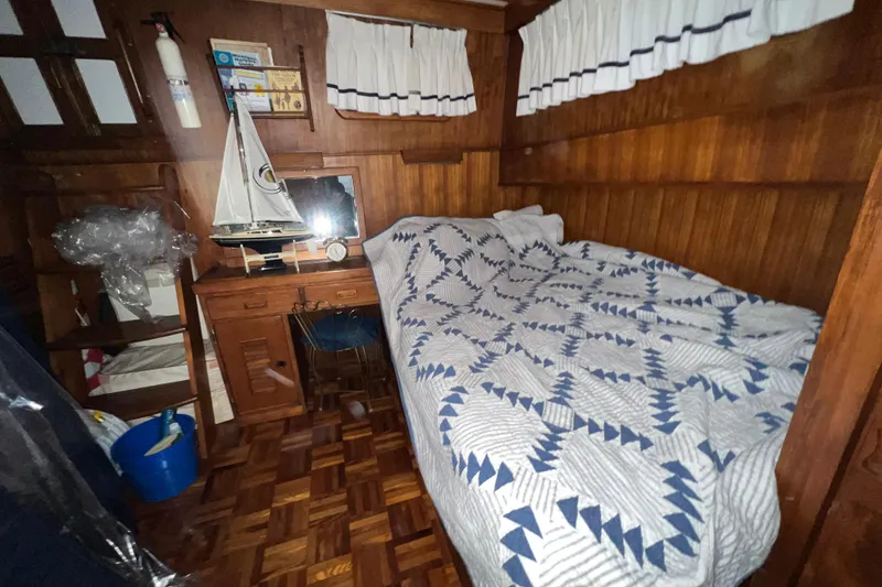 Slide: The Image of 1979 Litton Trawler bathroom with a compact shower and wooden trim. - 15