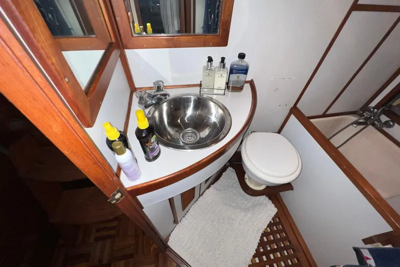 Slide: The Image of Engine room of a 1979 Litton Trawler with a red diesel engine. - 16