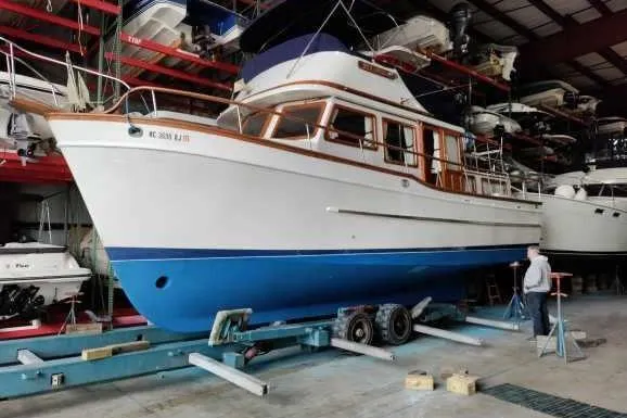 Slide: The Image of Cozy 1979 Litton Trawler cabin with wooden interior and nautical decor. - 3