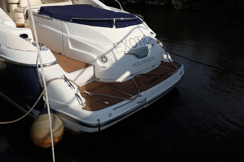 Slide: The Image of 2007 Cranchi Mediterranee 50 HT yacht docked, featuring elegant wooden deck and sleek design. - 11