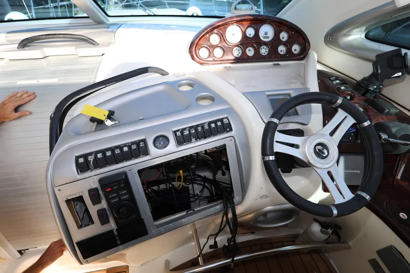 Slide: The Image of 2007 Cranchi Mediterranee 50 HT yacht dashboard with steering wheel and control panel. - 13
