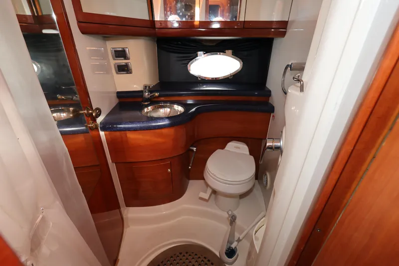 Slide: The Image of Luxurious bathroom in 2007 Cranchi Mediterranee 50 HT yacht with wood accents and modern fixtures. - 24