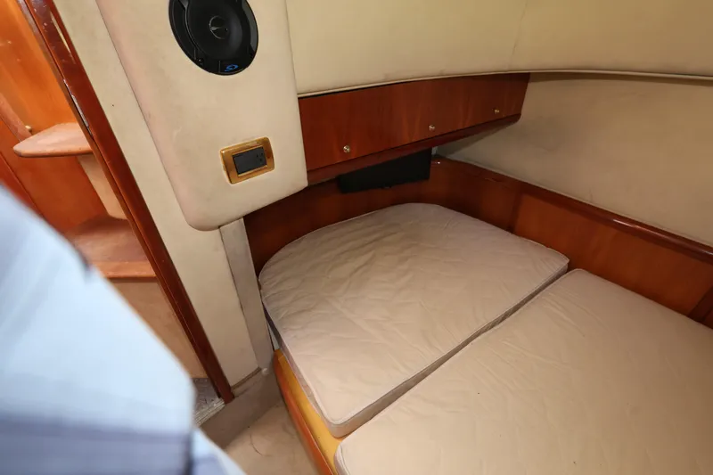 Slide: The Image of 2007 Cranchi Mediterranee 50 HT cabin interior with wooden accents and cushioned bed. - 29