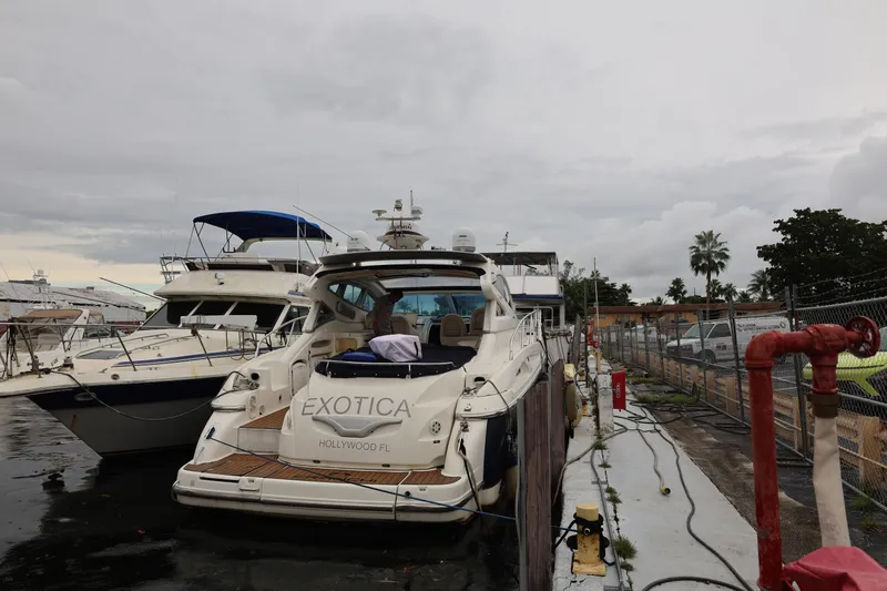 Slide: The Image of 2007 Cranchi Mediterranee 50 HT yacht docked in a marina, overcast sky. - 3