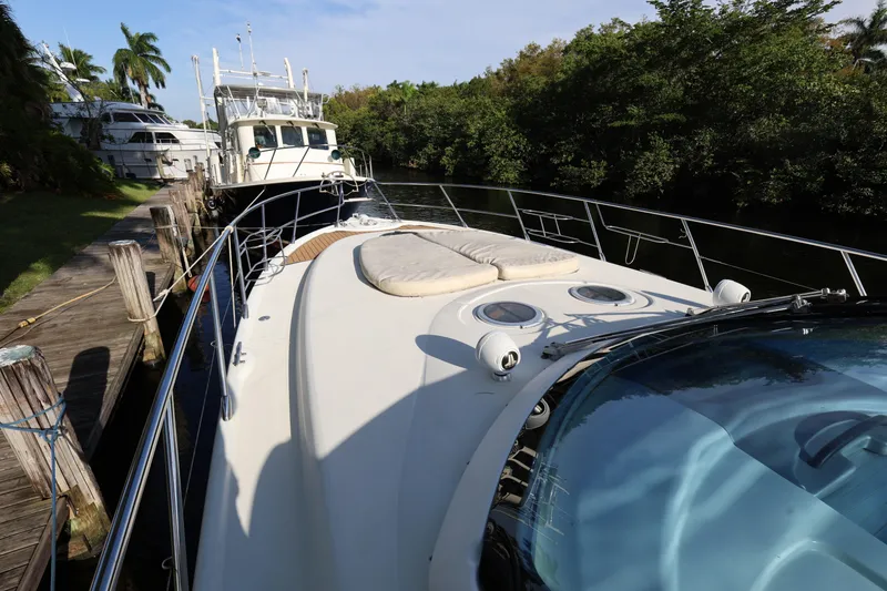 Slide: The Image of 2007 Cranchi Mediterranee 50 HT yacht docked near lush greenery. - 6