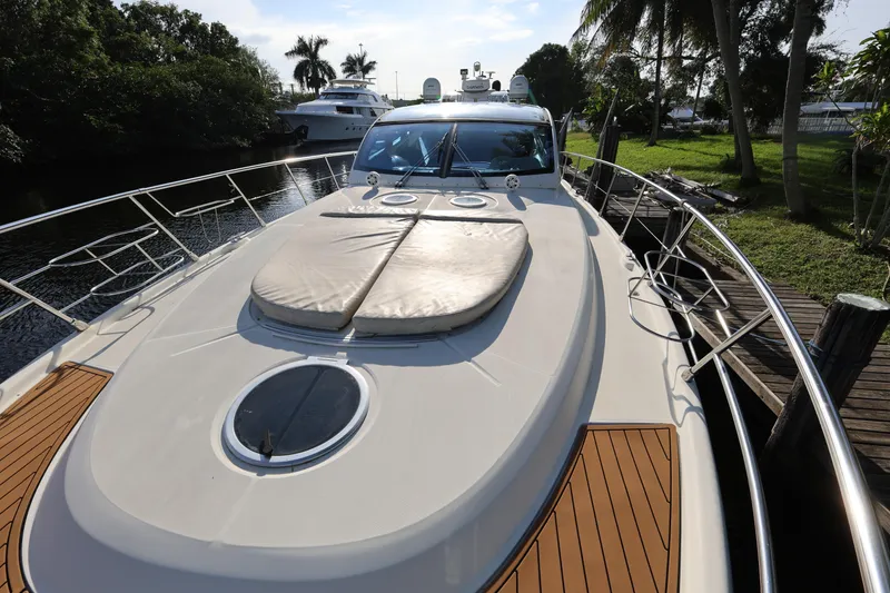 Slide: The Image of 2007 Cranchi Mediterranee 50 HT yacht docked, featuring sleek design and spacious deck. - 9