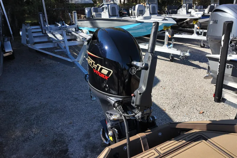 Slide: The Image of 2026 Xpress X18DB boat with Yamaha VMAX SHO outboard motor in a dealership lot. - 13