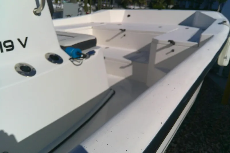 Slide: The Image of 2017 Outcast 19V boat interior with seating and rod holders. - 12