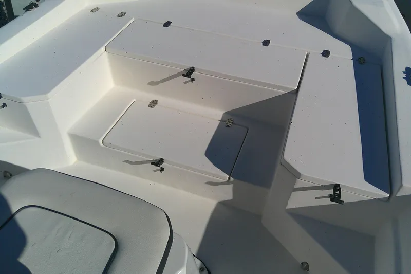 Slide: The Image of 2017 Outcast 19V boat interior with storage compartments and seating. - 15