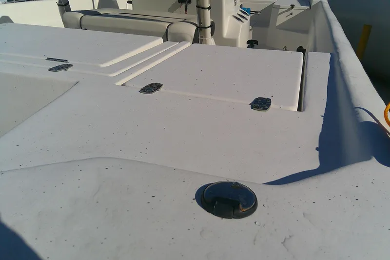 Slide: The Image of 2017 Outcast 19V boat interior with storage compartments and seating. - 24