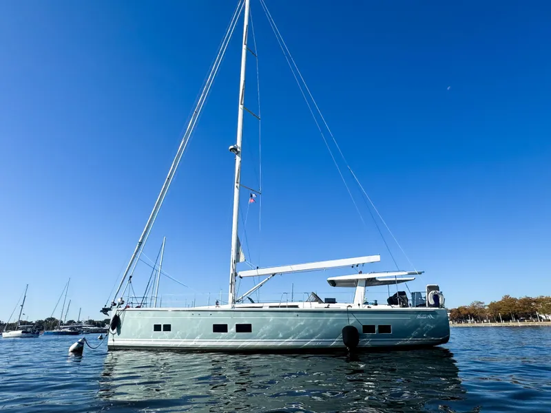 The Image of 2019 Hanse 588 yacht on calm water under clear blue sky. - 0