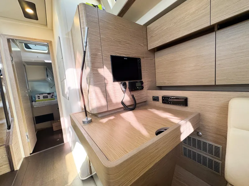 Slide: The Image of Modern interior of 2019 Hanse 588 yacht with sleek wooden finishes and built-in electronics. - 11