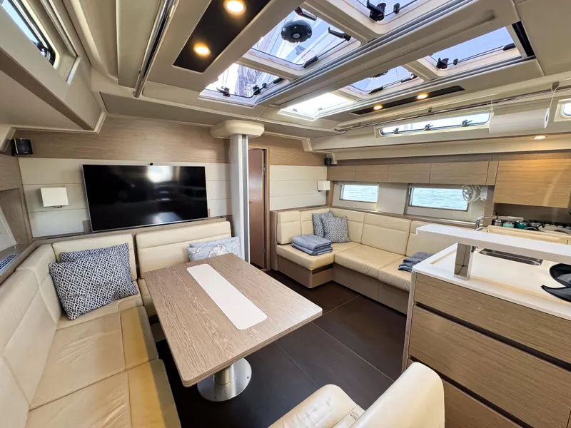 Slide: The Image of Luxurious interior of 2019 Hanse 588 yacht with modern seating and skylights. - 12